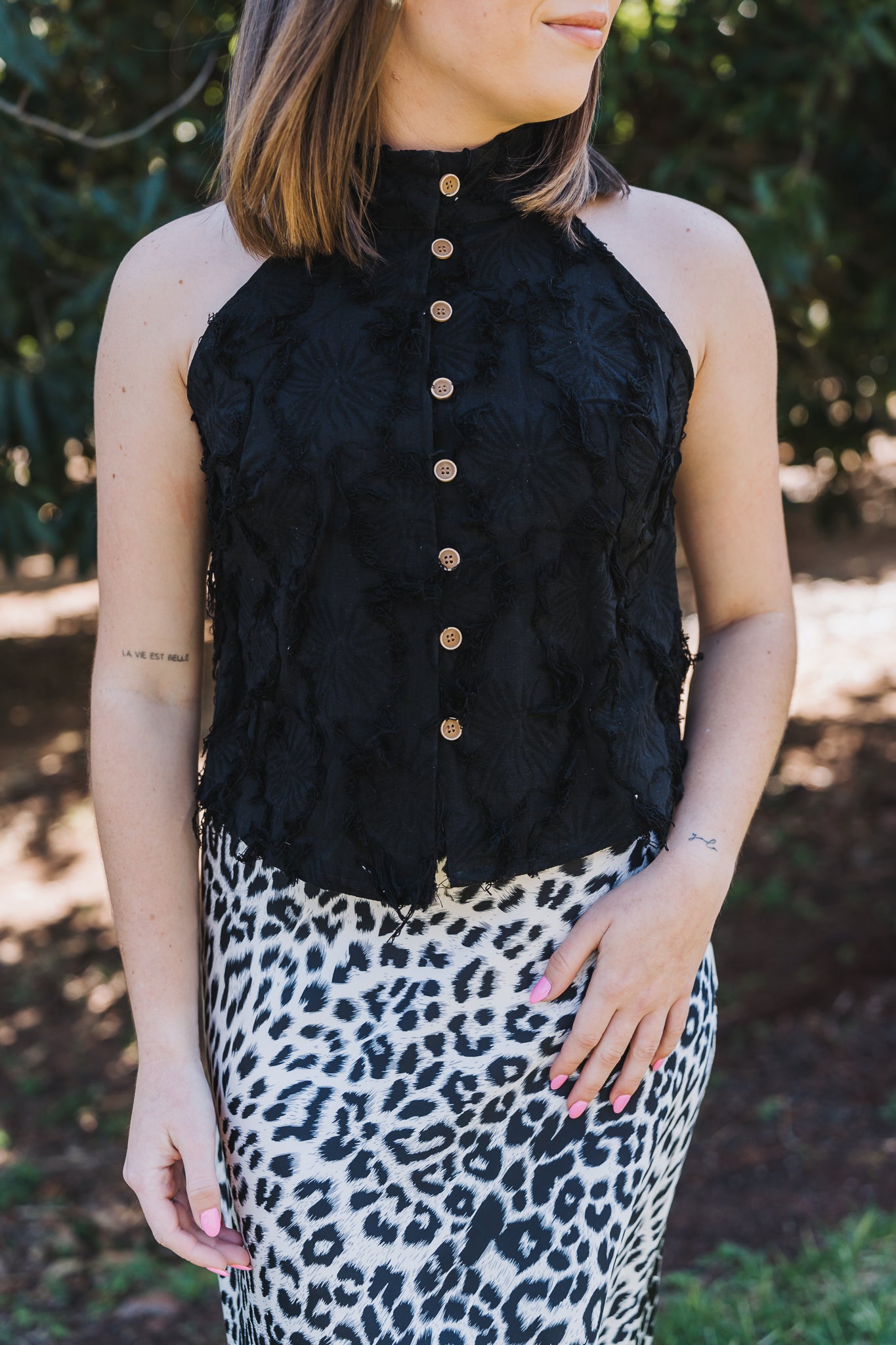 Sleeveless button-up